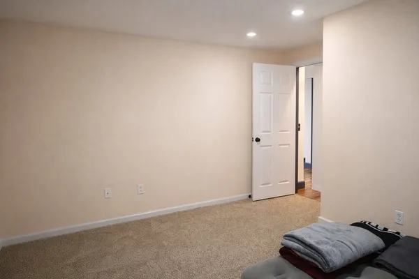 a kitchen with stainless steel appliances granite countertop a table chairs sink refrigerator and cabinets