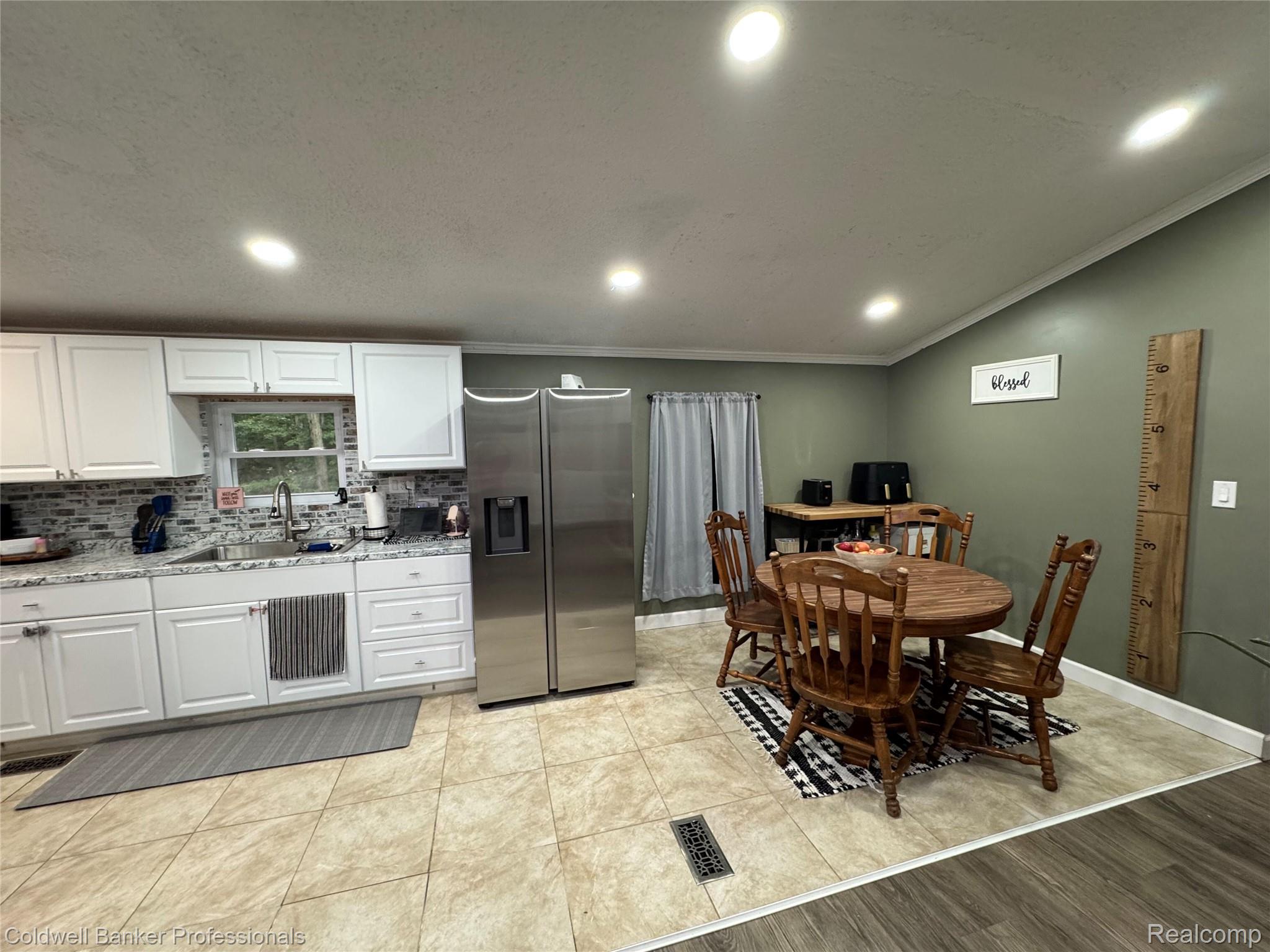 5323 English Road Clifford, MI 48727 - Photo 21 of 46 Kitchen featuring white cabinetry, a tile backsplash, and recessed lighting