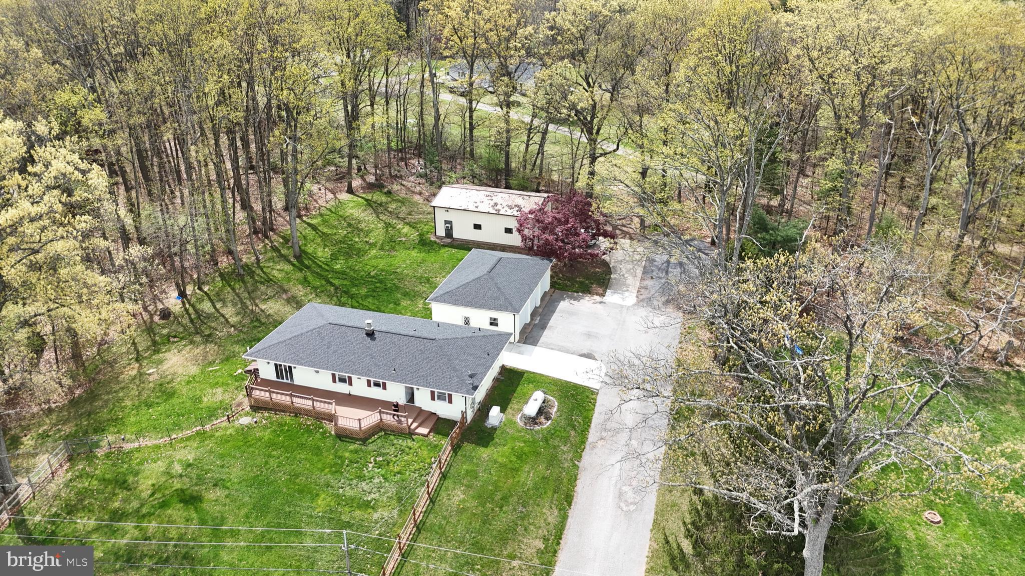 19422 Resh Mill Road Hampstead, MD 21074 - Photo 1 of 55 an aerial view of a house with a yard