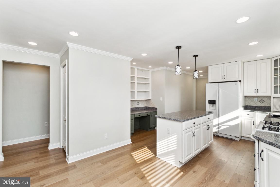 19422 Resh Mill Road Hampstead, MD 21074 - Photo 11 of 55 a kitchen with stainless steel appliances kitchen island granite countertop a refrigerator and a stove top oven