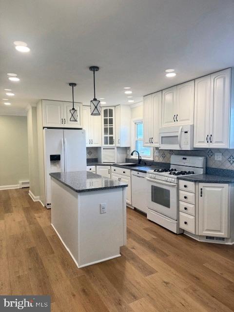 19422 Resh Mill Road Hampstead, MD 21074 - Photo 13 of 55 a kitchen with granite countertop white cabinets and white appliances