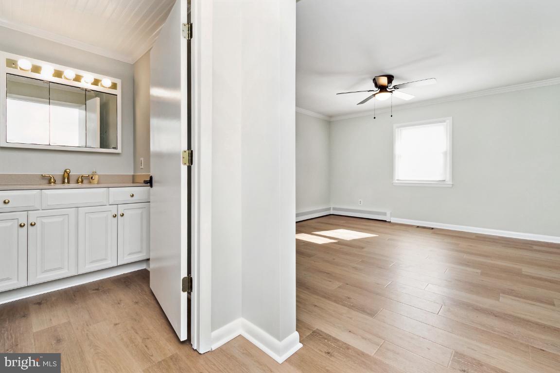 19422 Resh Mill Road Hampstead, MD 21074 - Photo 26 of 55 a view of a kitchen with wooden floor and window