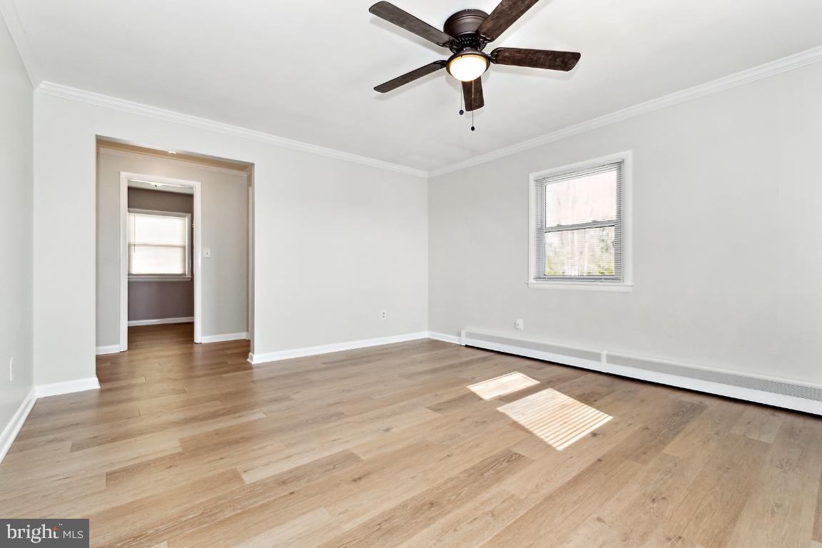 19422 Resh Mill Road Hampstead, MD 21074 - Photo 28 of 55 an empty room with wooden floor and windows