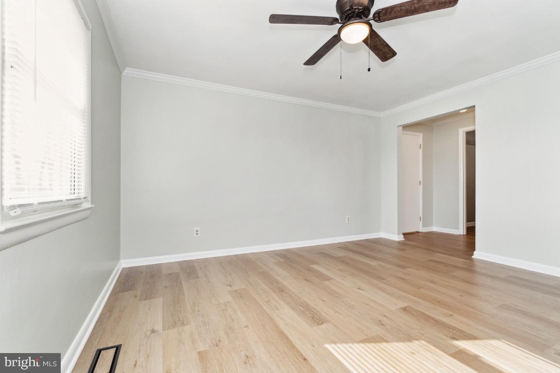 19422 Resh Mill Road Hampstead, MD 21074 - Photo 29 of 55 a view of empty room with wooden floor and ceiling fan