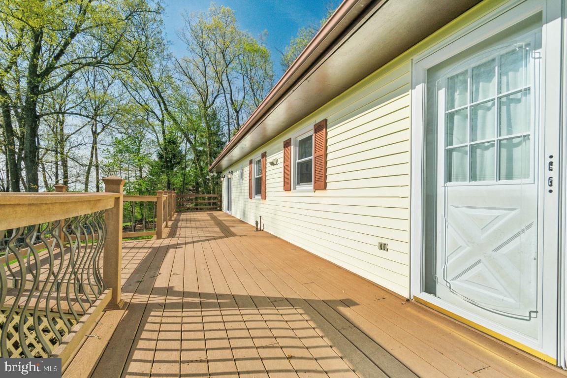 19422 Resh Mill Road Hampstead, MD 21074 - Photo 32 of 55 a view of a roof deck with wooden floor and fence