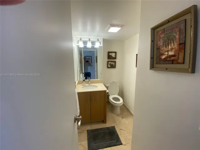 a view of hallway with wooden floor