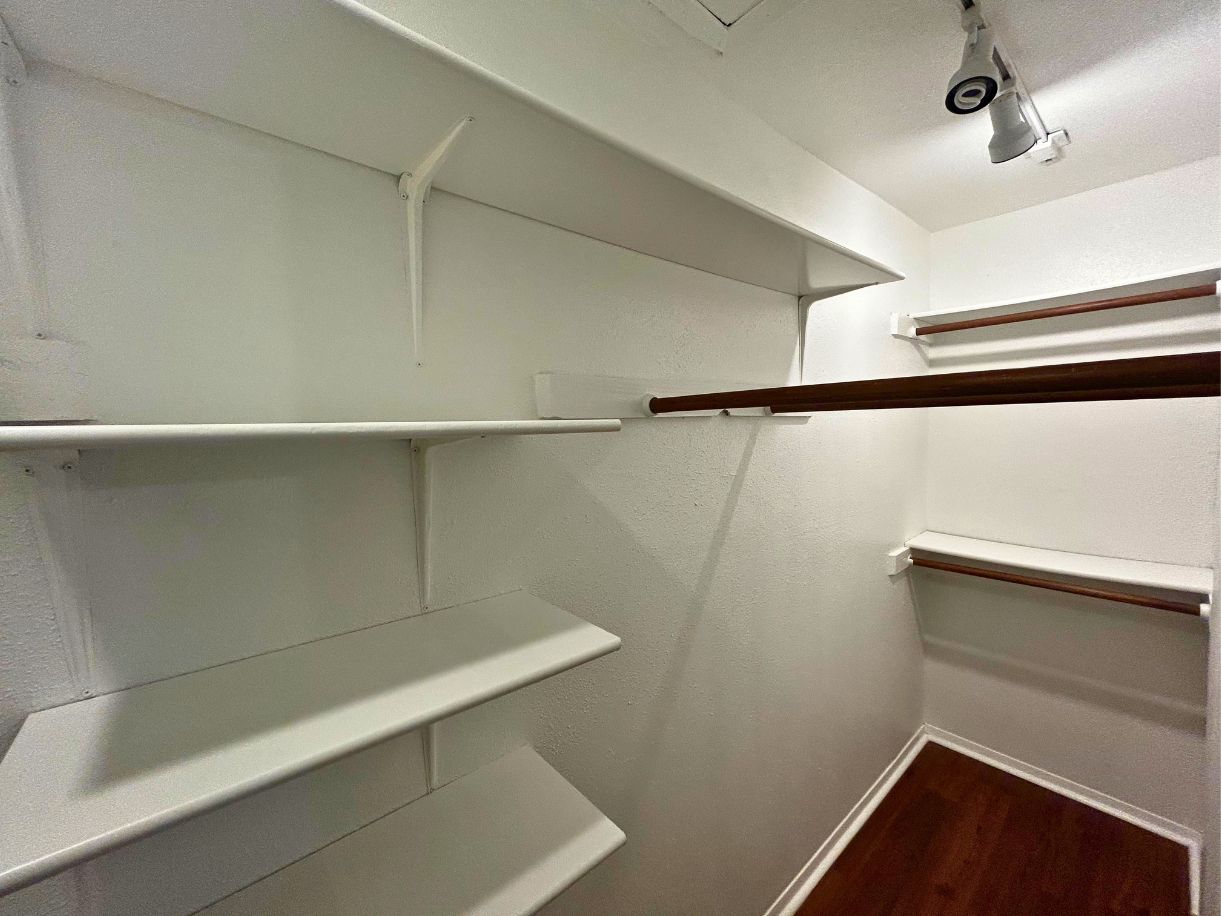 8210 Bent Tree Road, Unit 247 Austin, TX 78759 - Photo 10 of 21 a view of walk in closet with empty racks