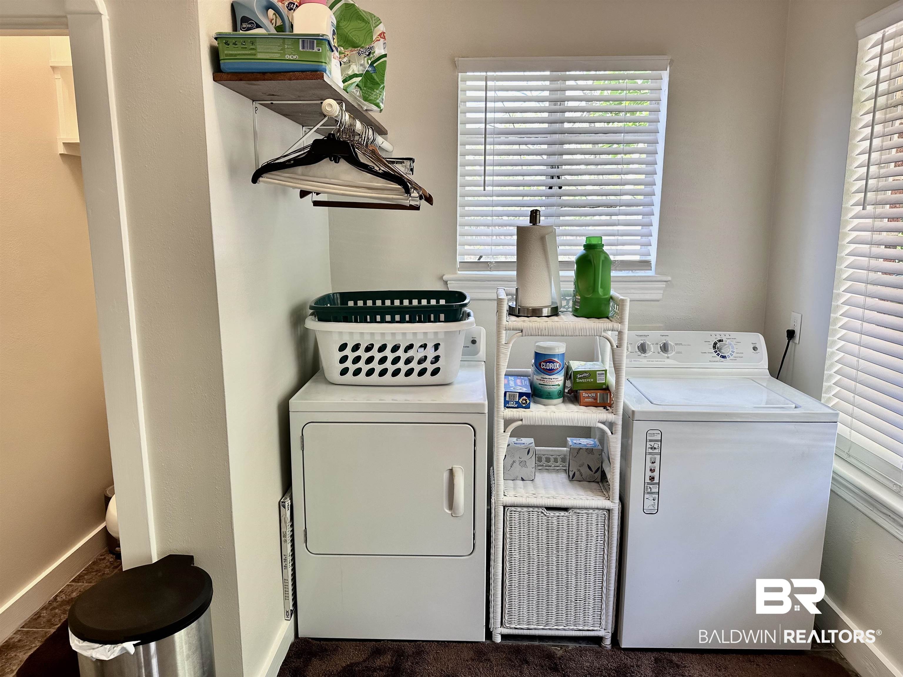 260 Siena Vista Street Mobile, AL 36607 - Photo 24 of 41 Laundry room with washer and dryer, plenty of natural light, and baseboards
