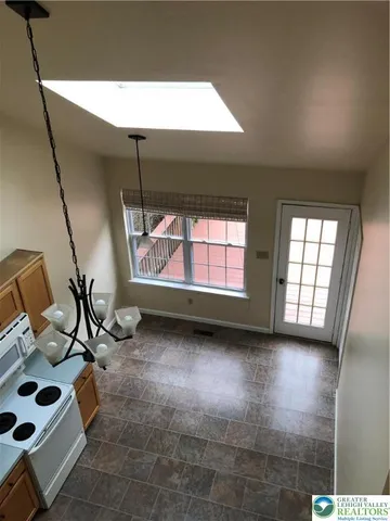 a view of a room with window and couch