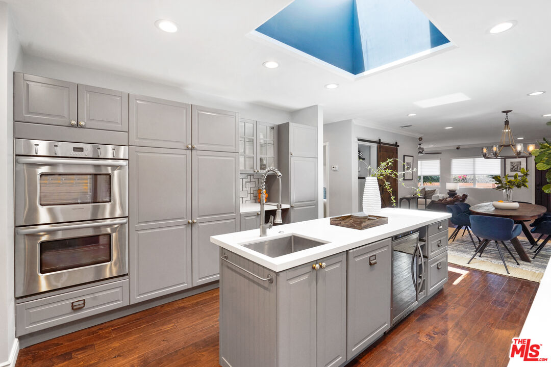 1774 Washington Way Venice, CA 90291 - Photo 14 of 42 a kitchen with a sink stove and cabinets