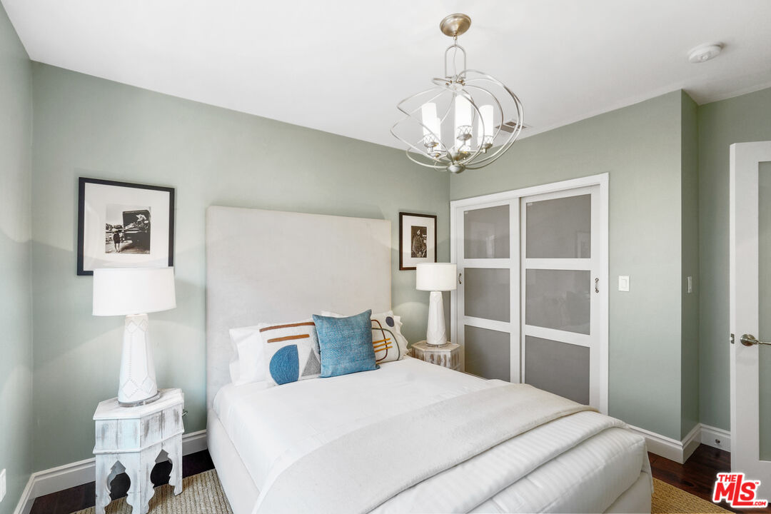 1774 Washington Way Venice, CA 90291 - Photo 17 of 42 a bedroom with a bed and a chandelier