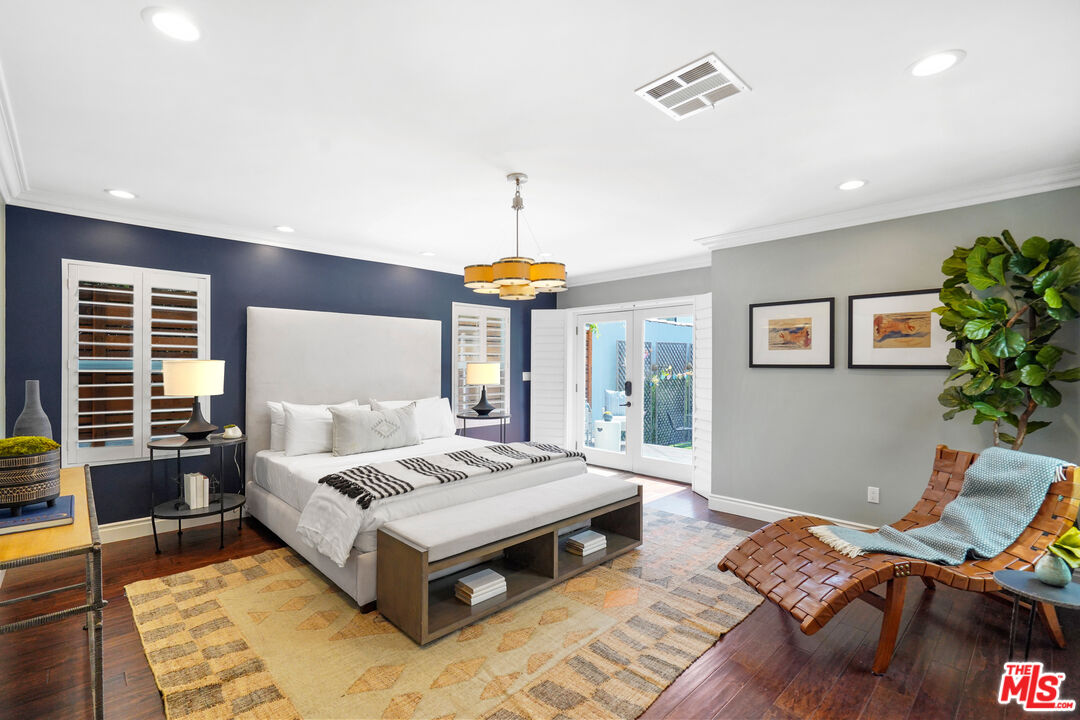 1774 Washington Way Venice, CA 90291 - Photo 21 of 42 a bedroom with a bed and wooden floor