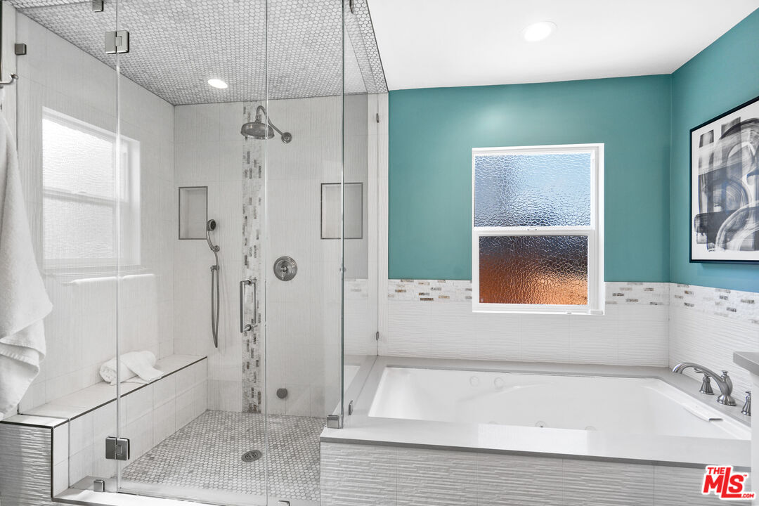 1774 Washington Way Venice, CA 90291 - Photo 25 of 42 a bathroom with a bathtub and a shower