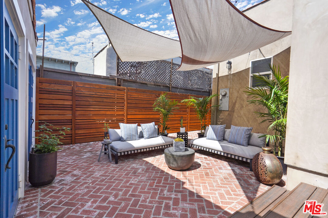 1774 Washington Way Venice, CA 90291 - Photo 28 of 42 a view of the patio with couches and potted plants