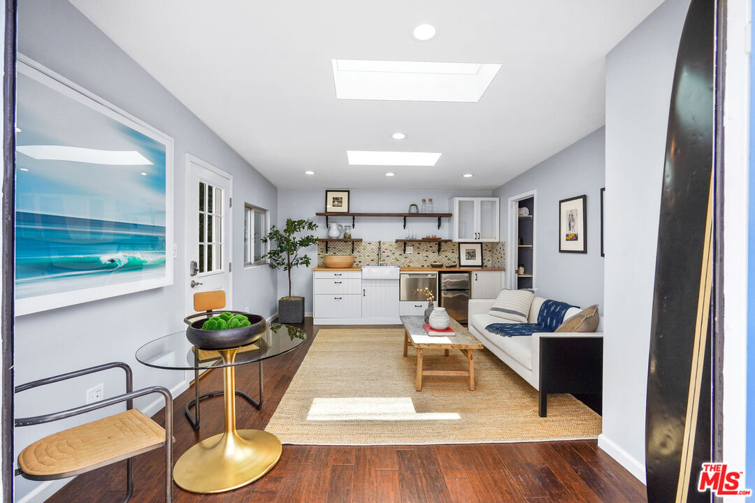 1774 Washington Way Venice, CA 90291 - Photo 33 of 42 a living room with dining room and wooden floor