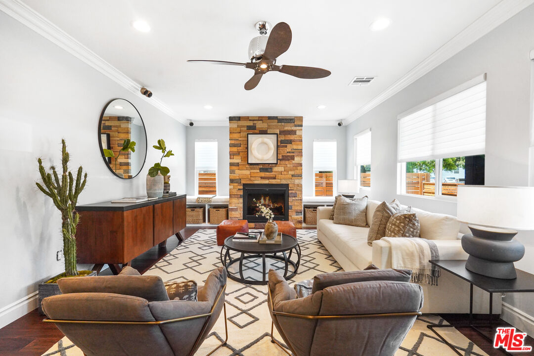 1774 Washington Way Venice, CA 90291 - Photo 8 of 42 a living room with furniture a fireplace and a large window