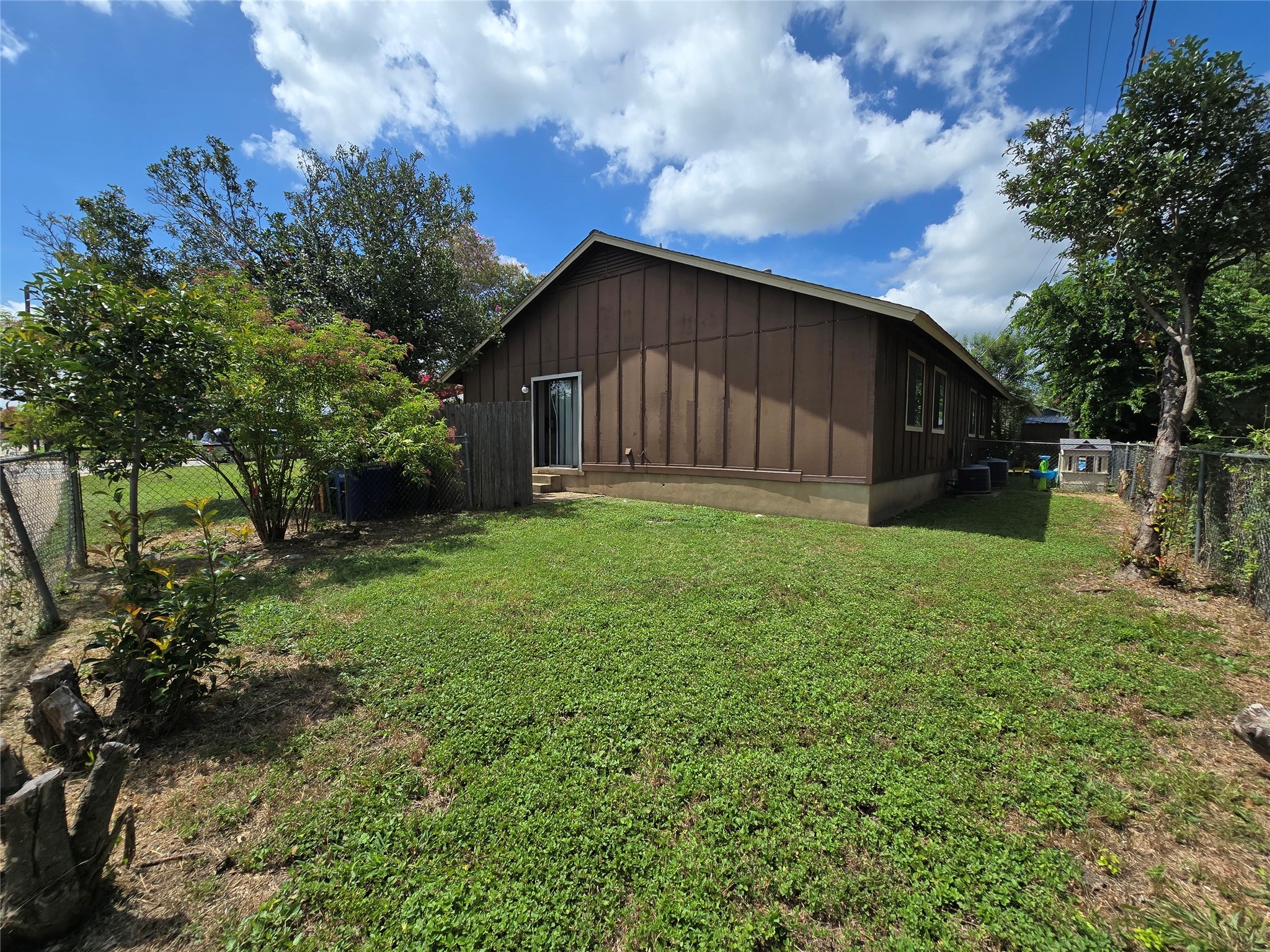 6206 Buffalo Pass, Unit A Austin, TX 78745 - Photo 22 of 24 A spacious yard surrounds this charming home, offering ample outdoor enjoyment.