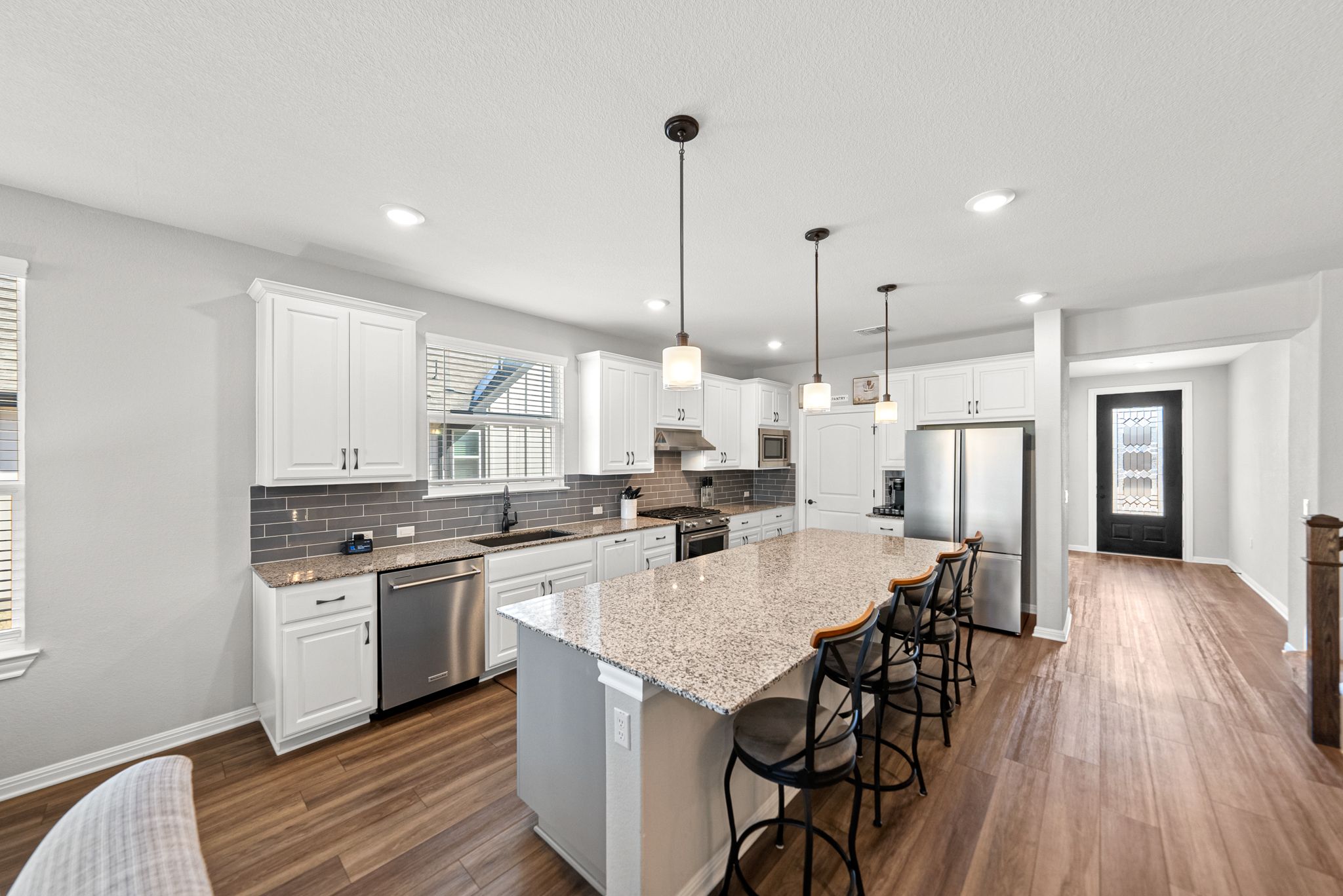 642 Martingale Street Georgetown, TX 78633 - Photo 11 of 40 This kitchen is as functional as it is beautiful. The oversized granite island serves as the perfect hub for morning coffee or casual happy hours.