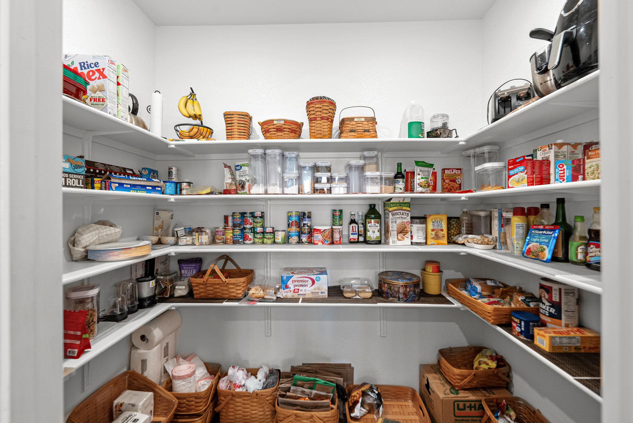642 Martingale Street Georgetown, TX 78633 - Photo 14 of 40 An organizer's dream! This deep, wrap-around pantry provides an incredible amount of storage for bulk goods, small appliances, and household essentials, keeping your kitchen counters completely clutter-free.
