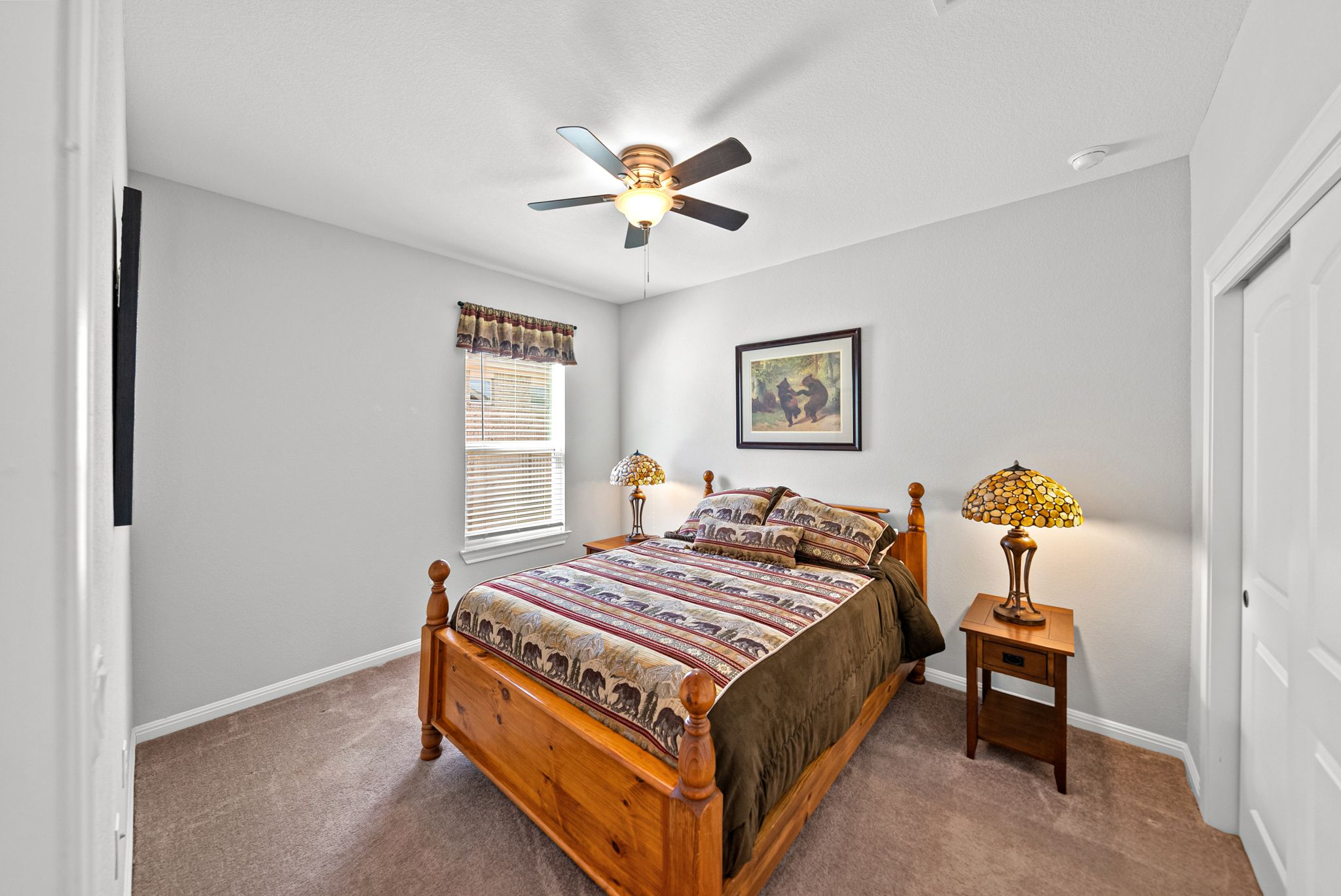 642 Martingale Street Georgetown, TX 78633 - Photo 24 of 40 This secondary bedroom on the main floor, offers a warm and inviting space with ample room for a queen-sized suite, making it perfect for overnight guests.