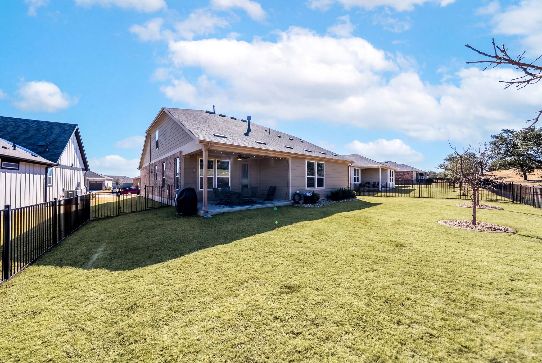642 Martingale Street Georgetown, TX 78633 - Photo 39 of 40 This view showcases the generous size of the lot and the privacy provided by the elevation at the rear of the property, ensuring your outdoor time remains quiet and serene.