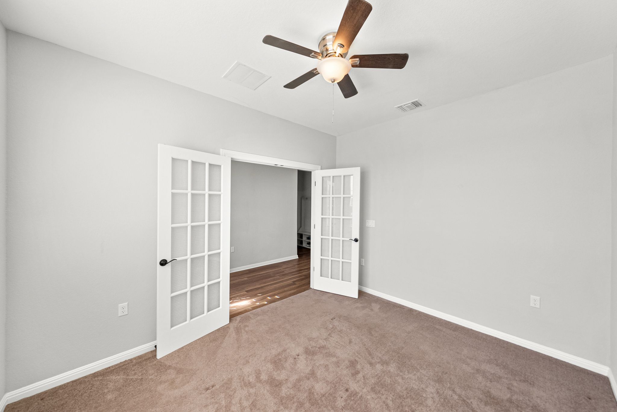 642 Martingale Street Georgetown, TX 78633 - Photo 5 of 40 Off the entry, the glass french doors lead you into a bright flex space that would be perfect for a dedicated home office, a quiet reading den, or a craft room to pursue your favorite hobbies.