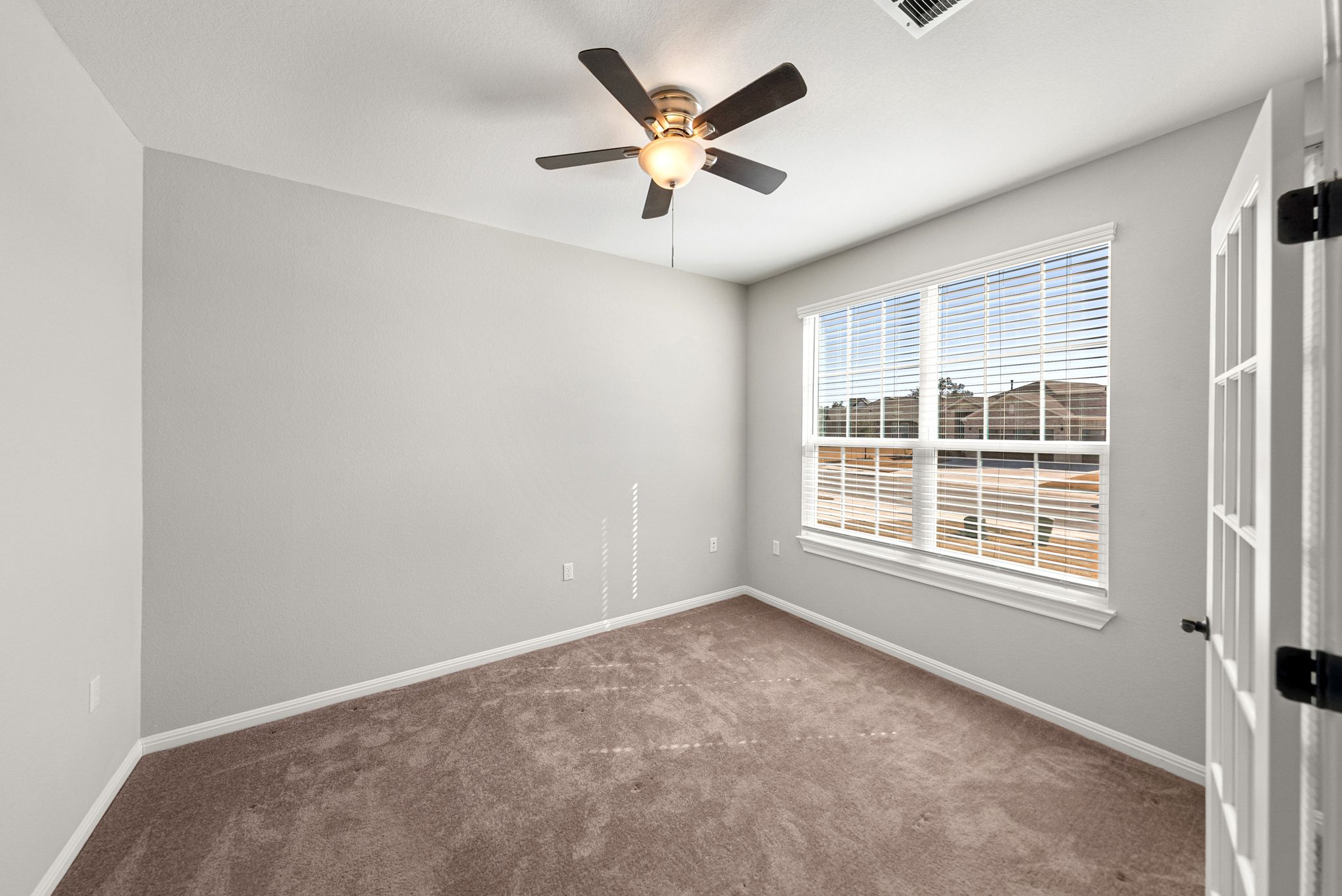 642 Martingale Street Georgetown, TX 78633 - Photo 6 of 40 Large windows flood this room with natural light.