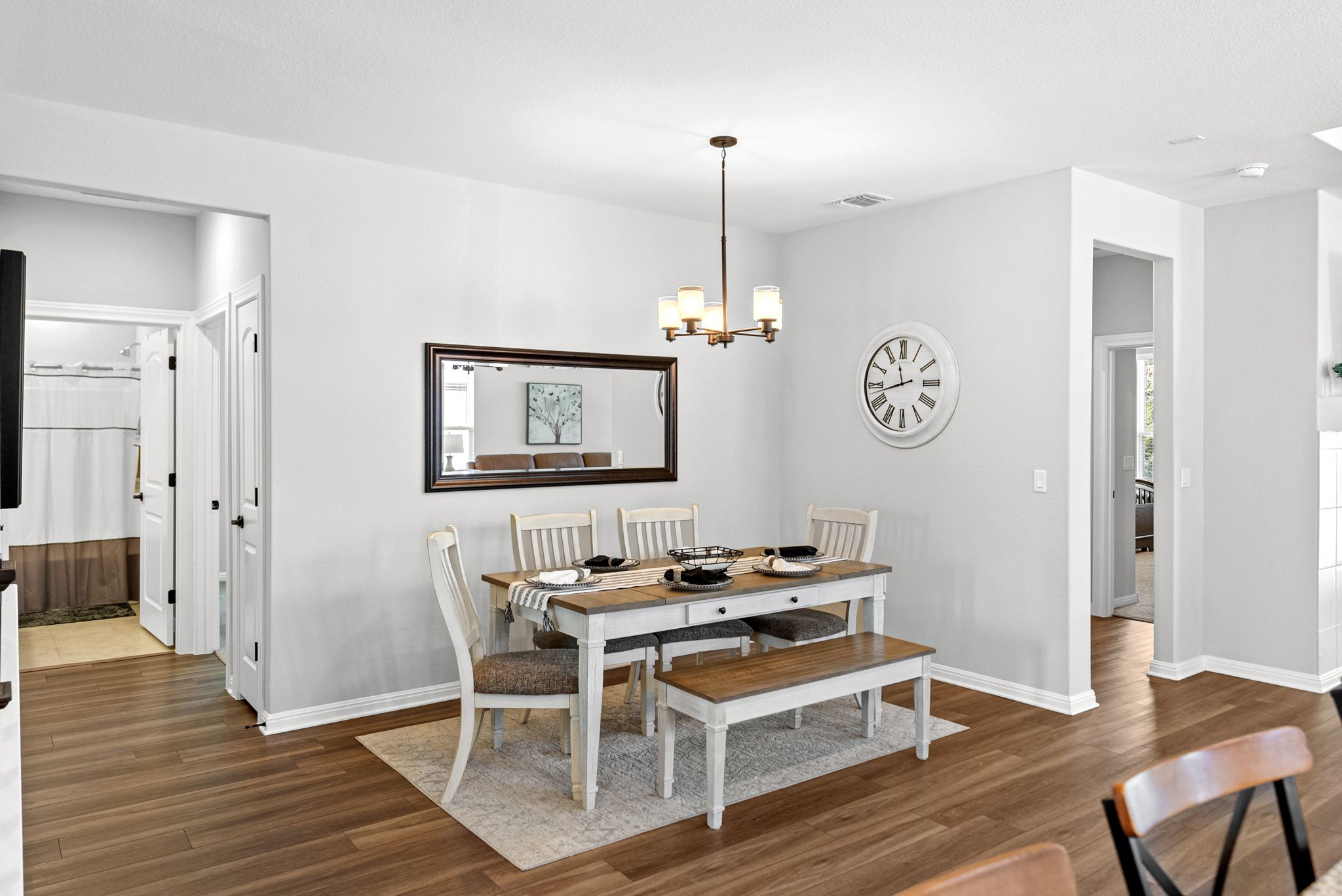 642 Martingale Street Georgetown, TX 78633 - Photo 9 of 40 Host dinners with ease in this dedicated dining area. The modern chandelier completes this space with a touch of sophistication.