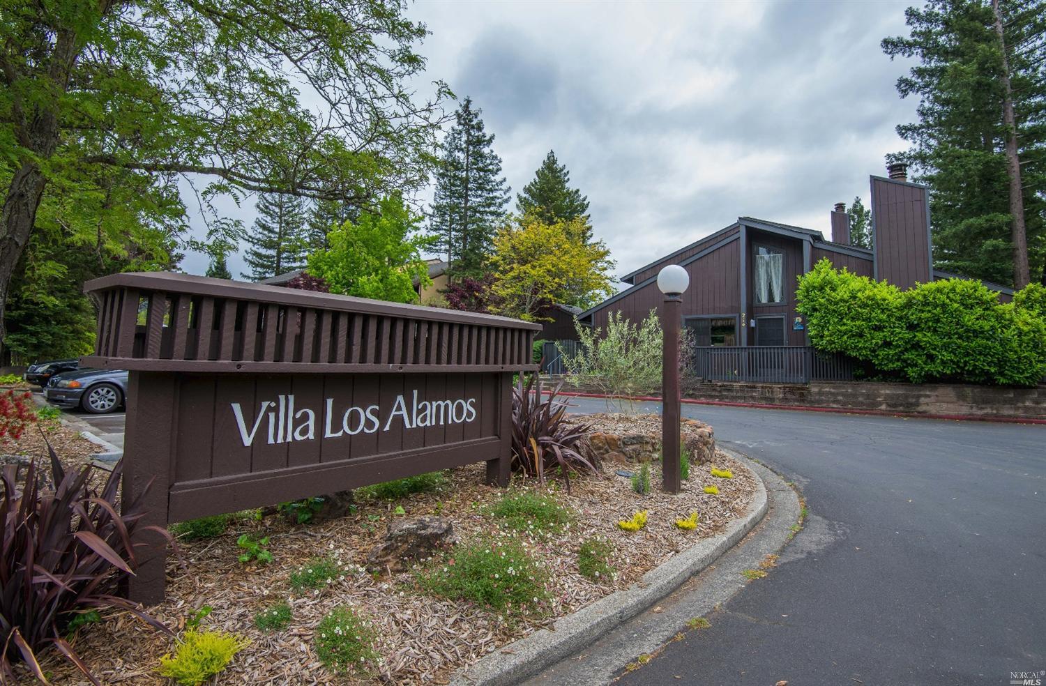 300 Los Alamos Road, Unit 201 Santa Rosa, CA 95409 - Photo 1 of 1 a view of a street sign under a large tree