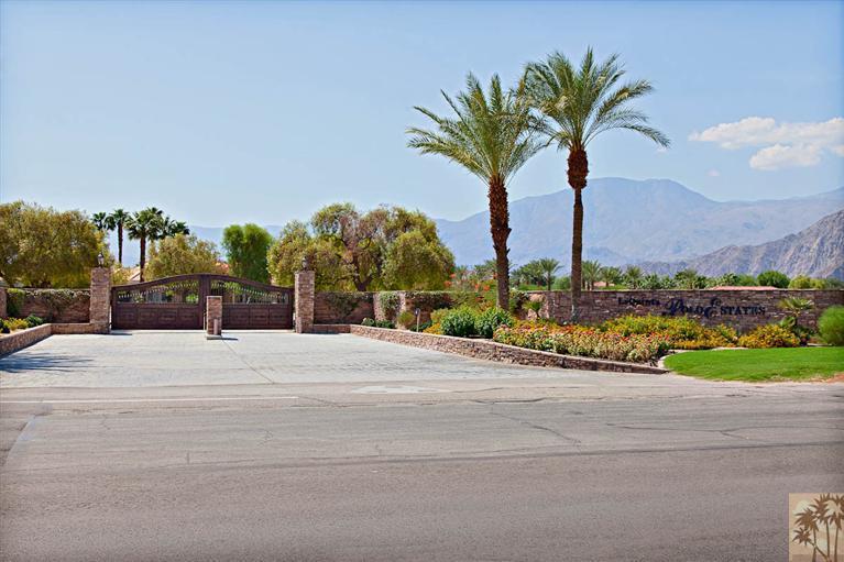 0 Vista Montana Road, Unit LOT 2 La Quinta, CA 92253 - Photo 11 of 11 a front view of multiple houses with yard and lake view