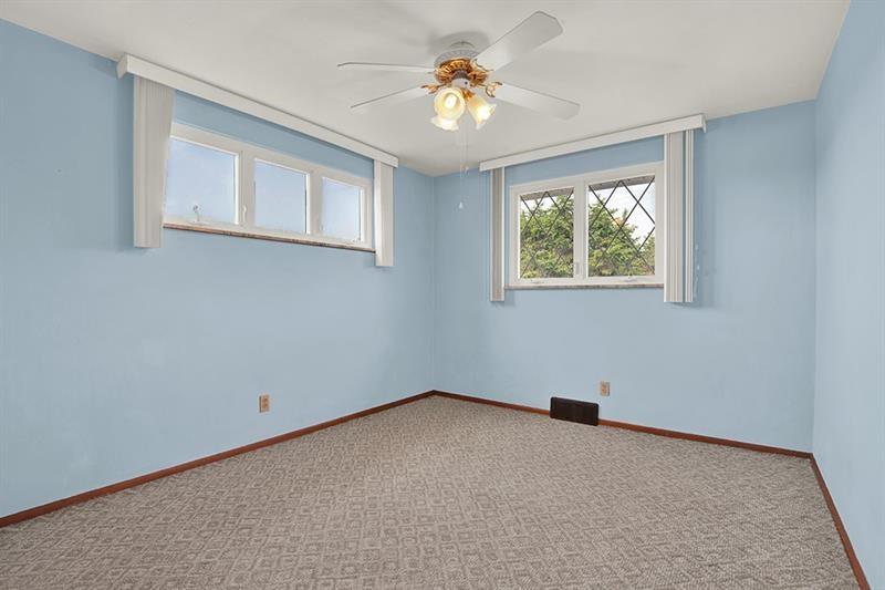 1409 Gill Hall Road Clairton, PA 15025 - Photo 14 of 29 an empty room with windows and closet