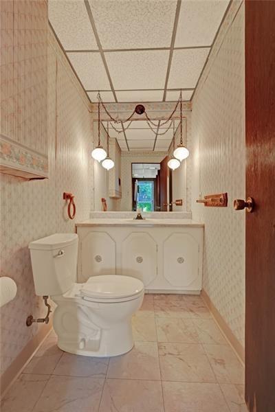 1409 Gill Hall Road Clairton, PA 15025 - Photo 18 of 29 a bathroom with a toilet sink and mirror