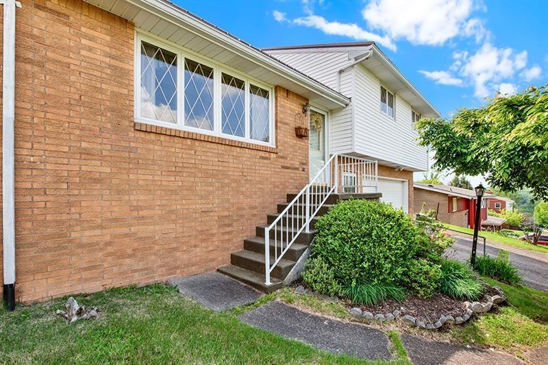 1409 Gill Hall Road Clairton, PA 15025 - Photo 3 of 29 a front view of a house with a yard