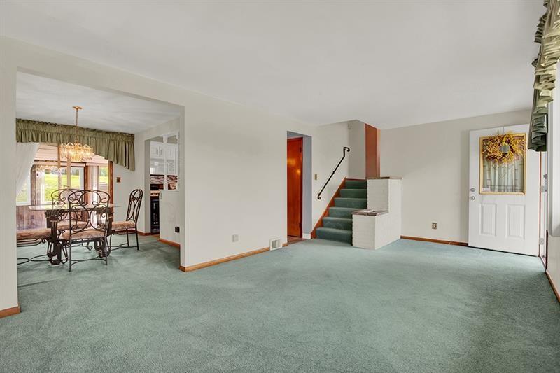 1409 Gill Hall Road Clairton, PA 15025 - Photo 5 of 29 a view of a livingroom with furniture and staircase