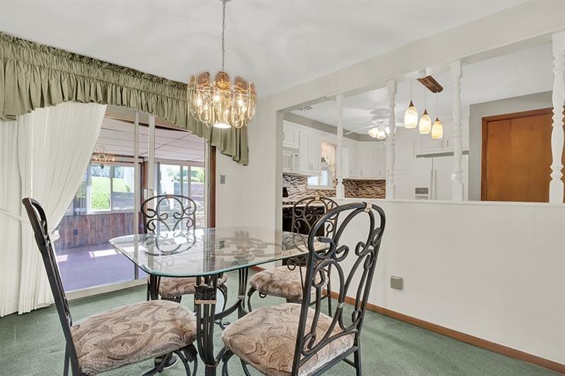 1409 Gill Hall Road Clairton, PA 15025 - Photo 9 of 29 a view of a dining room with furniture and chandelier