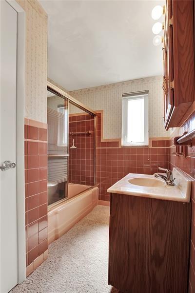 1409 Gill Hall Road Clairton, PA 15025 - Photo 10 of 29 a bathroom with a sink and a mirror