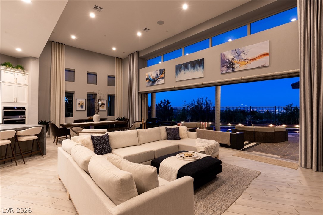 6014 Willow Ridge Court Las Vegas, NV 89135 - Photo 90 of 99 This expansive living area seamlessly transitions to an outdoor oasis, perfect for entertaining.