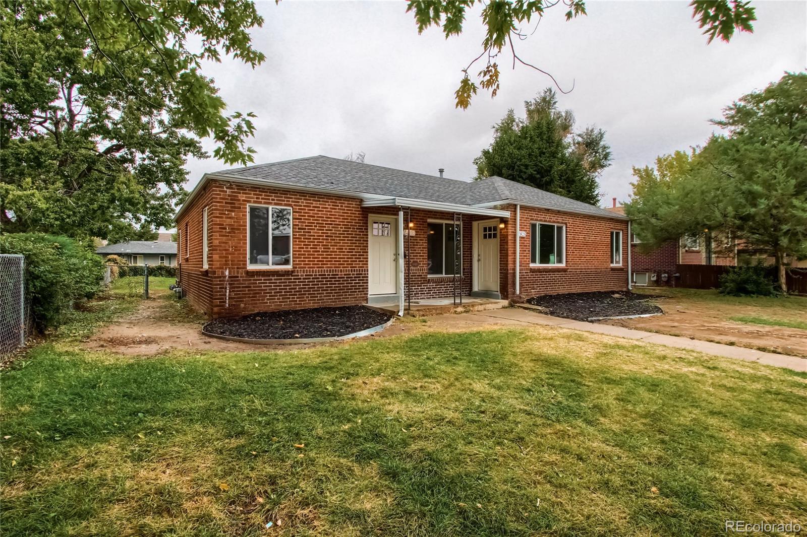 2821 Harrison Street Denver, CO 80205 - Photo 1 of 24 a view of a house with backyard and sitting area