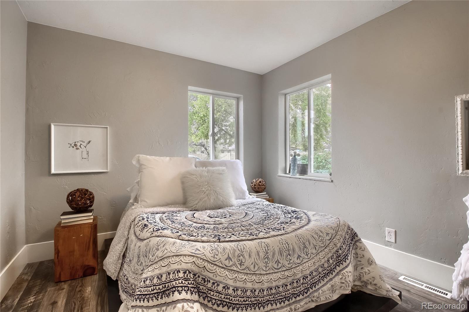 2821 Harrison Street Denver, CO 80205 - Photo 14 of 24 a bedroom with a bed and a window