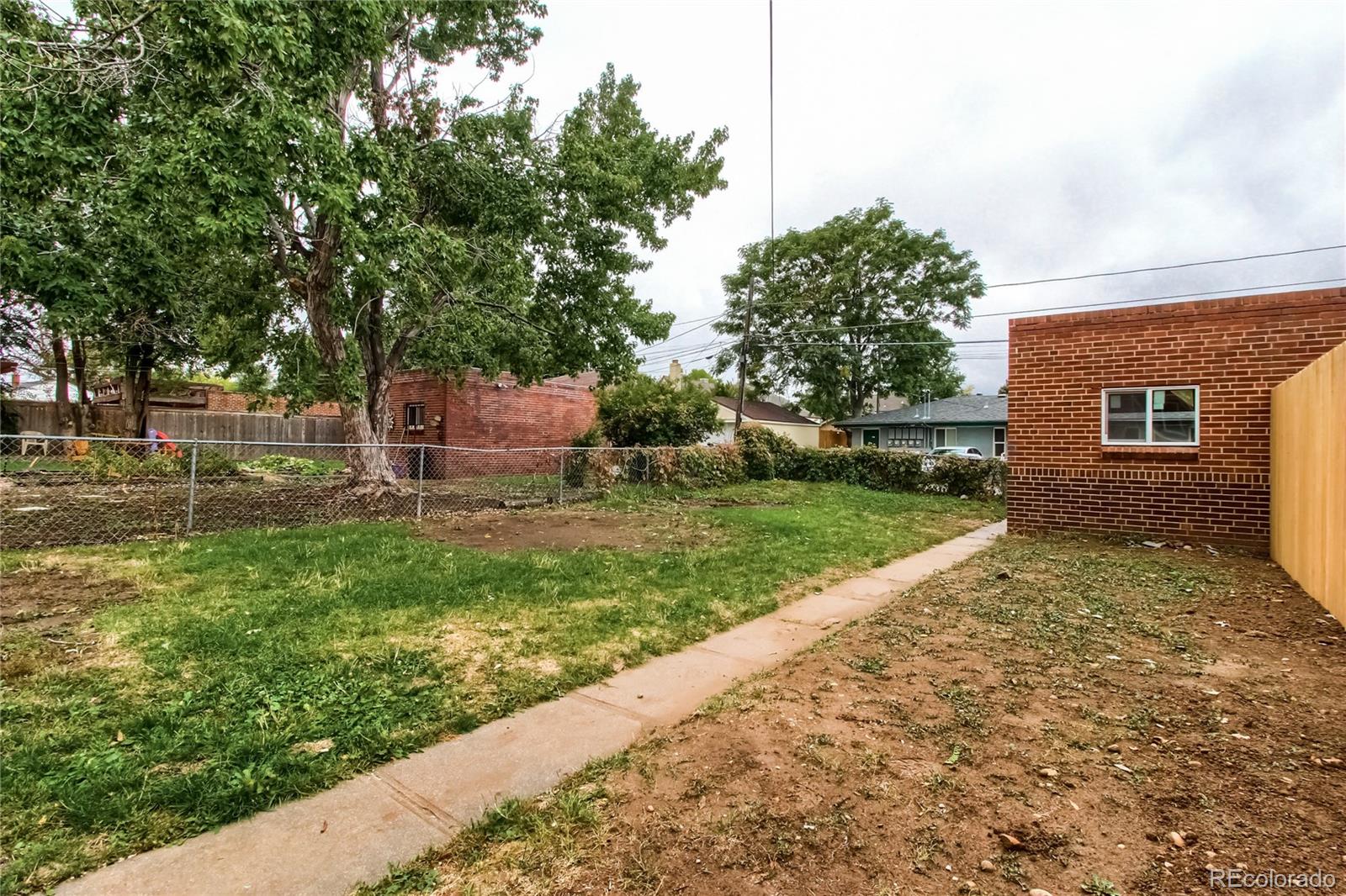 2821 Harrison Street Denver, CO 80205 - Photo 22 of 24 front view of a house with a yard