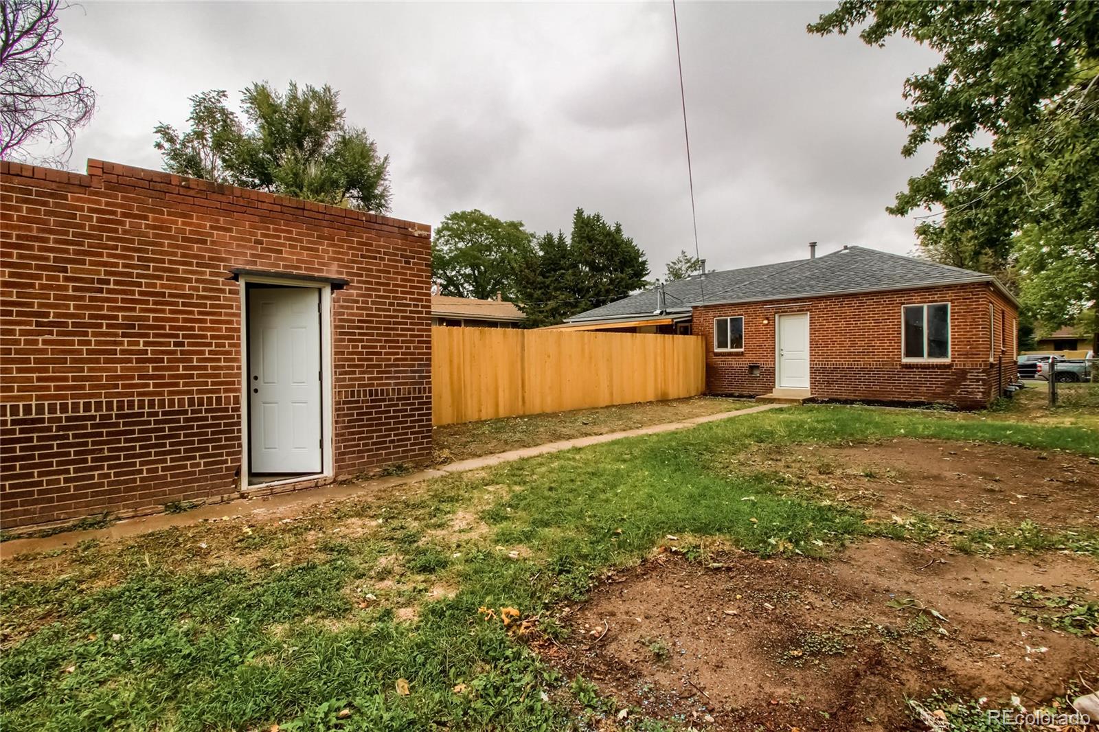 2821 Harrison Street Denver, CO 80205 - Photo 24 of 24 a front view of house with yard