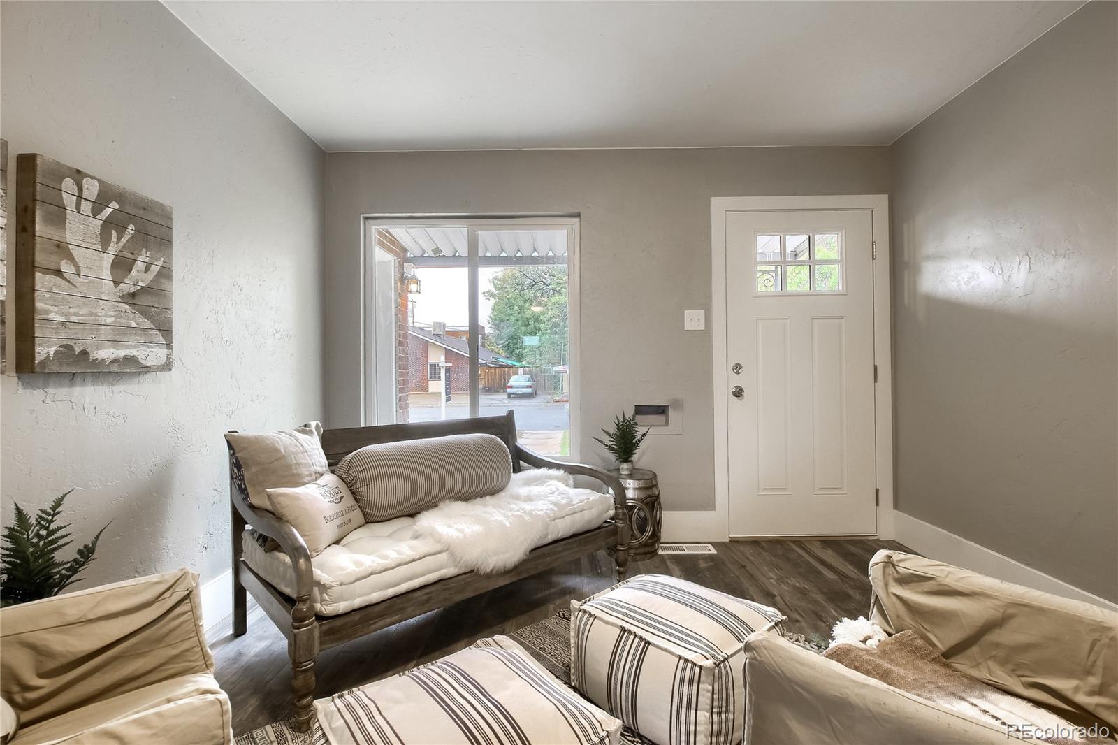 2821 Harrison Street Denver, CO 80205 - Photo 3 of 24 a bedroom with furniture and a window