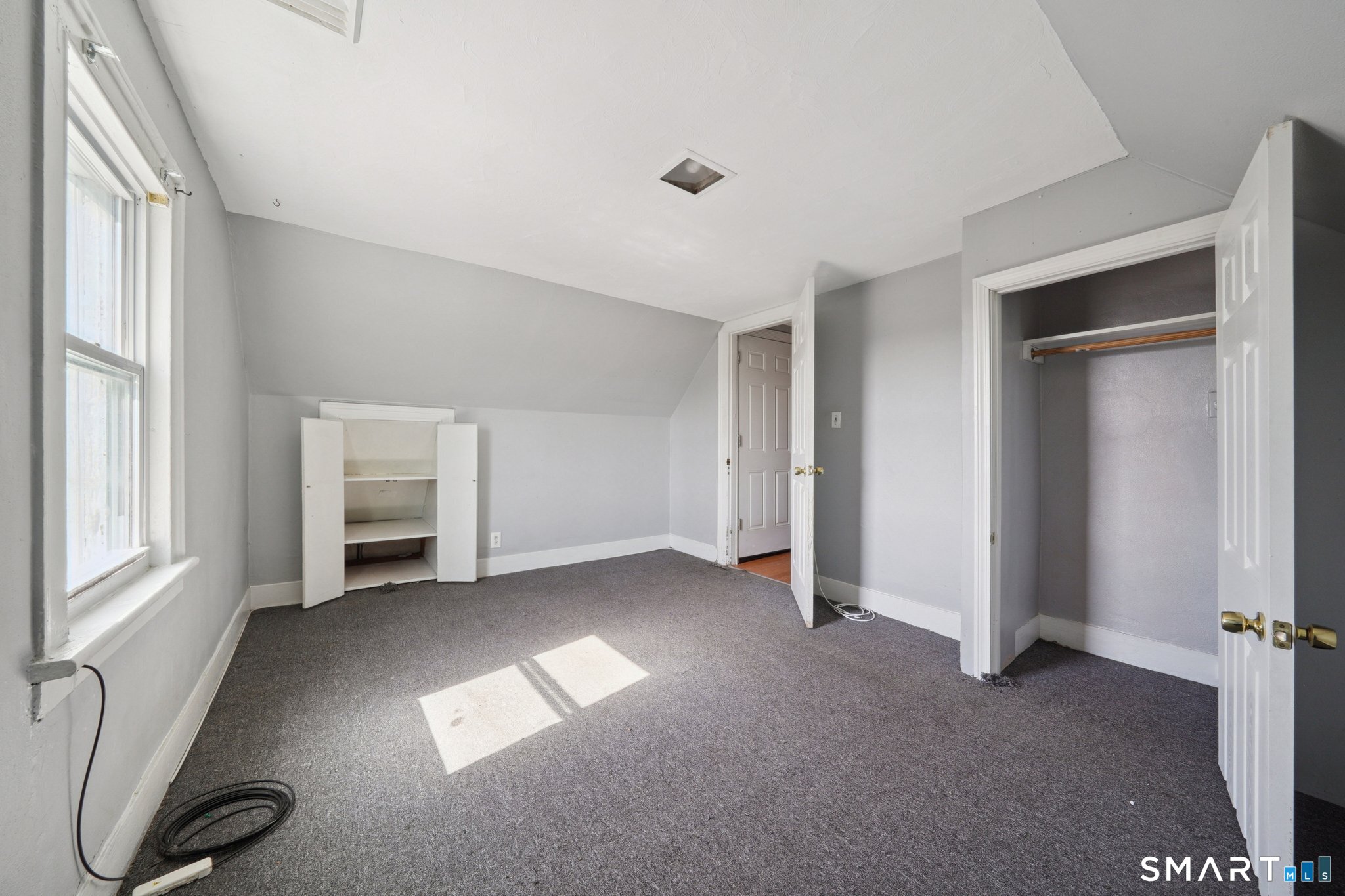 73 Orange Street Bridgeport, CT 06607 - Photo 22 of 33 an empty room with windows