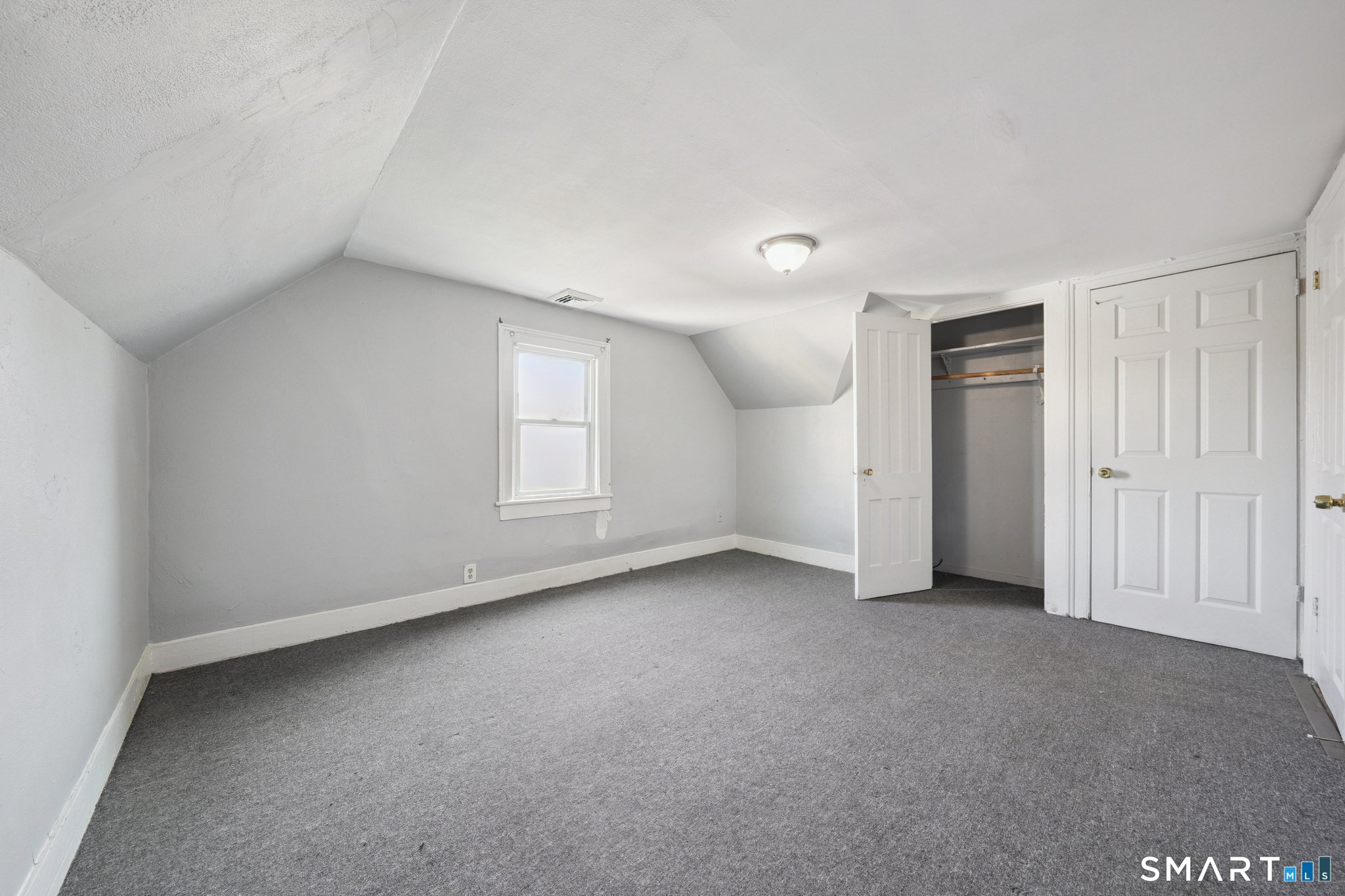 73 Orange Street Bridgeport, CT 06607 - Photo 23 of 33 a view of an empty room with a window