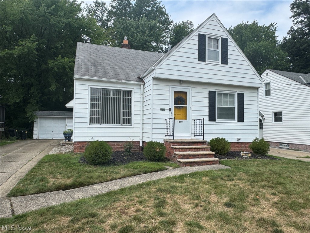 1132 Gordon Road Cleveland, OH 44124 - Photo 2 of 28 White aluminum siding exterior with concrete walk and drive