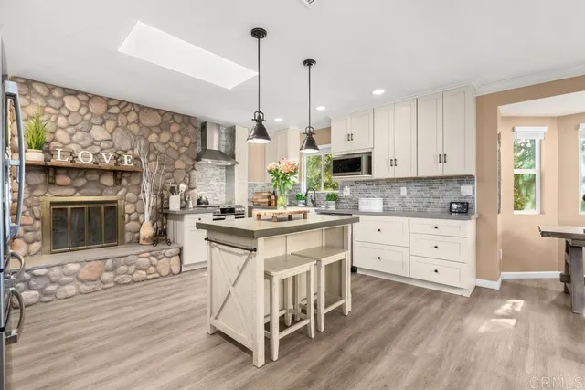 a view of a dining room with furniture large windows and wooden floor