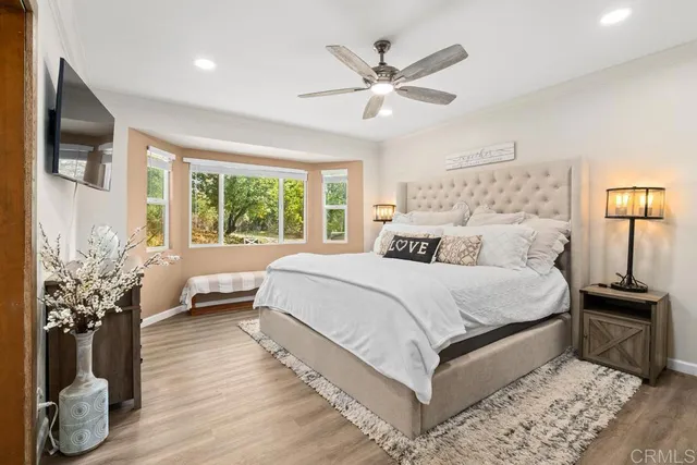a bathroom with a sink vanity mirror and toilet