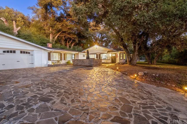 a front view of a house with yard