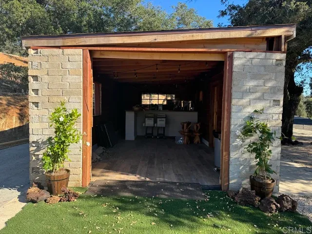a view of a patio with table and chairs