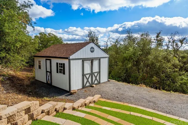 a view of a studio with wooden floor
